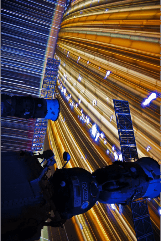 Astronaut Don Pettit Snapped This Image of The Russian Soyuz Spacecraft, Attached To The ISS with Earth Streaming Below &amp; Stars Streaming above, From Inside The Station.