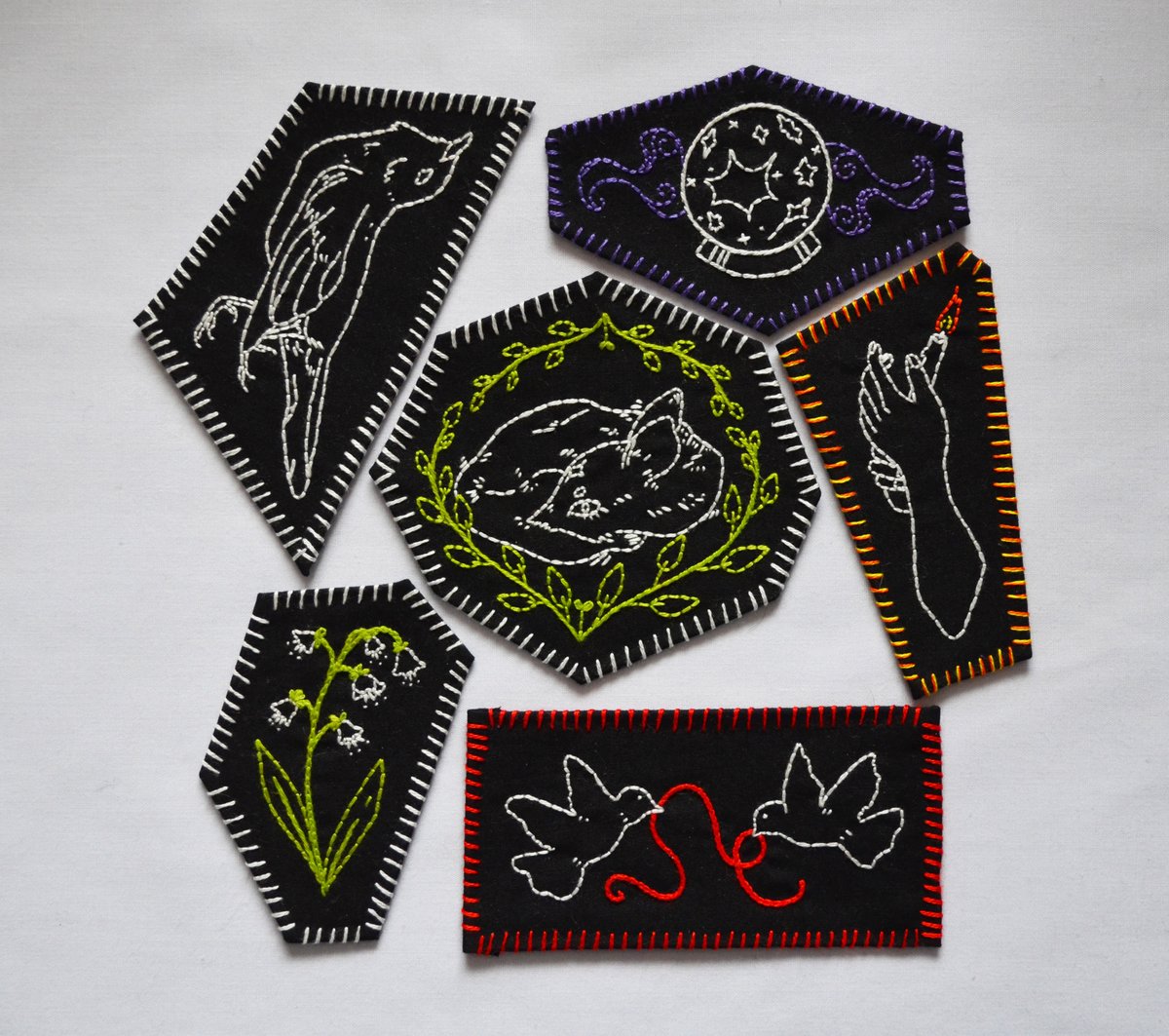 New patches available in my store! Designs by <a href="/angelaerium/">eden 🕯️</a> , stitched by me :) ko-fi.com/feonix/shop #embroidery