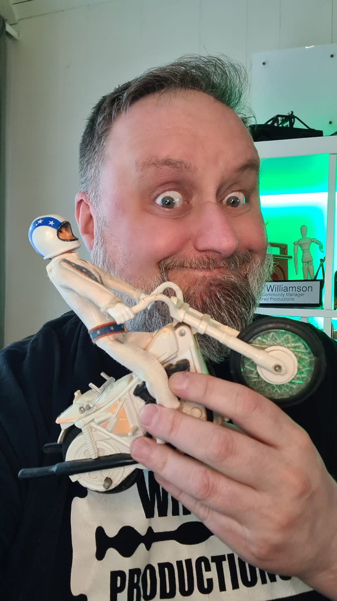Steve From Wired showing off his Evel Knievel stunt motorcycle toy.
