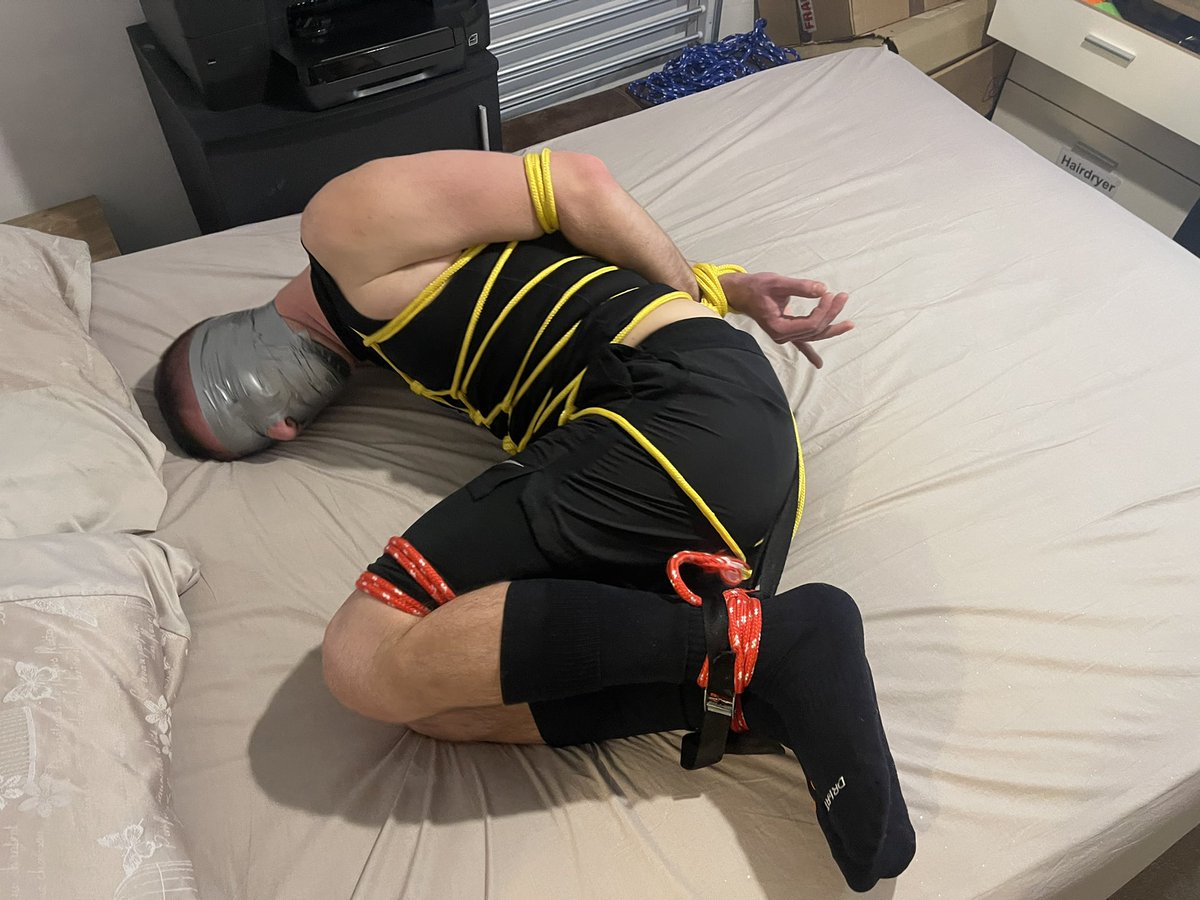 BondageNW's tweet photo. Serves this runner right for acting suspiciously around my apartment while out for a run! He’s now well &amp; truly hogtied &amp; securely tape gagged &amp; tape blindfolded! https://t.co/JBrxIEaT91