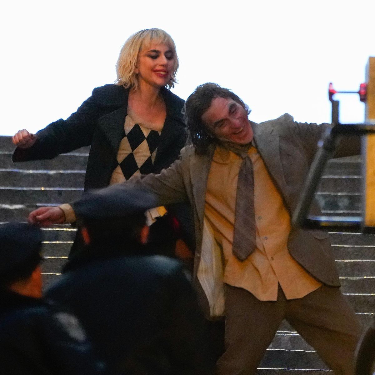 screenbowl's tweet photo. New set photos from the upcoming Joker: Folie à Deux show off more of Joaquin Phoenix in the titular role of the #Joker and in the latest batch of photos, Phoenix’s character looks pretty roughed up. Lady Gaga also appears hyped.
#Joker2 #JokerFolieADeux #screenbowl https://t.co/GbXG29mYL4