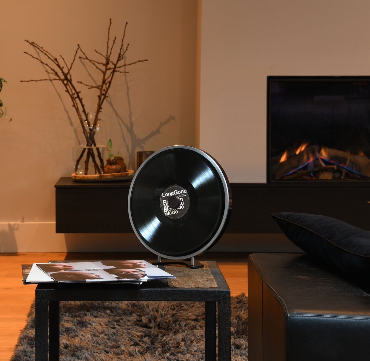 The Miniot Wheel 2 is a record player that can be placed flat on a table, mounted on a wall, or at an angle on its supplied stand. 

It plays your records from the back, meaning there is no outwardly visible tone arm, cartridge, or electronics.

Link: silodrome.com/miniot-wheel-2…