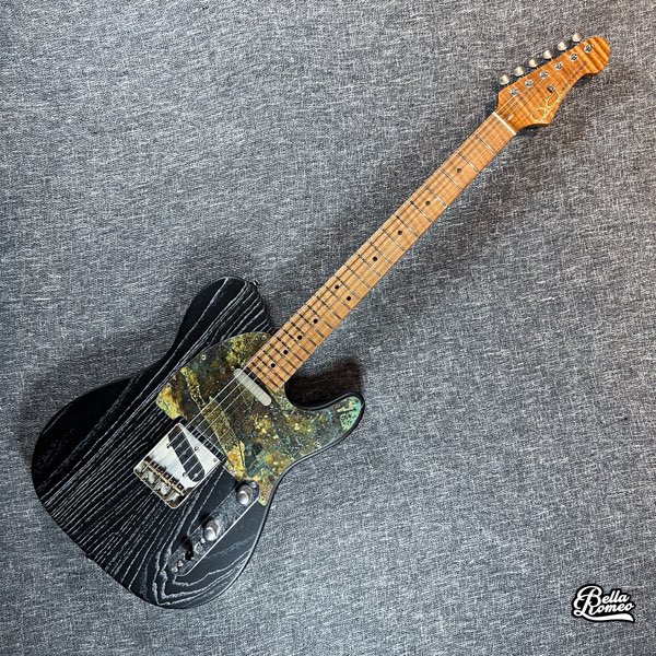 Patrick James Eggle Oz-t in Grained Black.  Just look at that brass pickguard!  In stock.  #stratocaster #strat #6string #ernieball #guitar #guitarworld #guitarlife #guitarsofinstagram #instaguitar #guitarsarebetter #patrickjameseggle