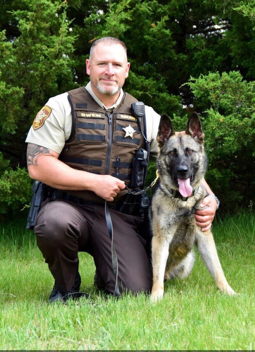 From the Pope County, MN Sheriff's Office:
As has been reported, Deputy Josh Owen has served the Pope County Sheriff’s Office for nearly twelve years. The attached picture shows Deputy Owen with his beloved canine Karma.

Deputy Owen had a heart as big as his stature. He leaves