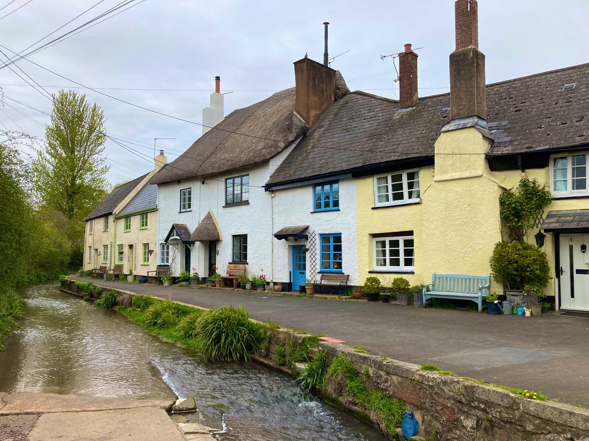 College Lane, Ide (a small village a mile outside Exeter). Fordland Brook flows over the surface making it perhaps the only road in England to be predominately under water. Several of the cottages date from the medieval era. #history #travel #Devon #UK