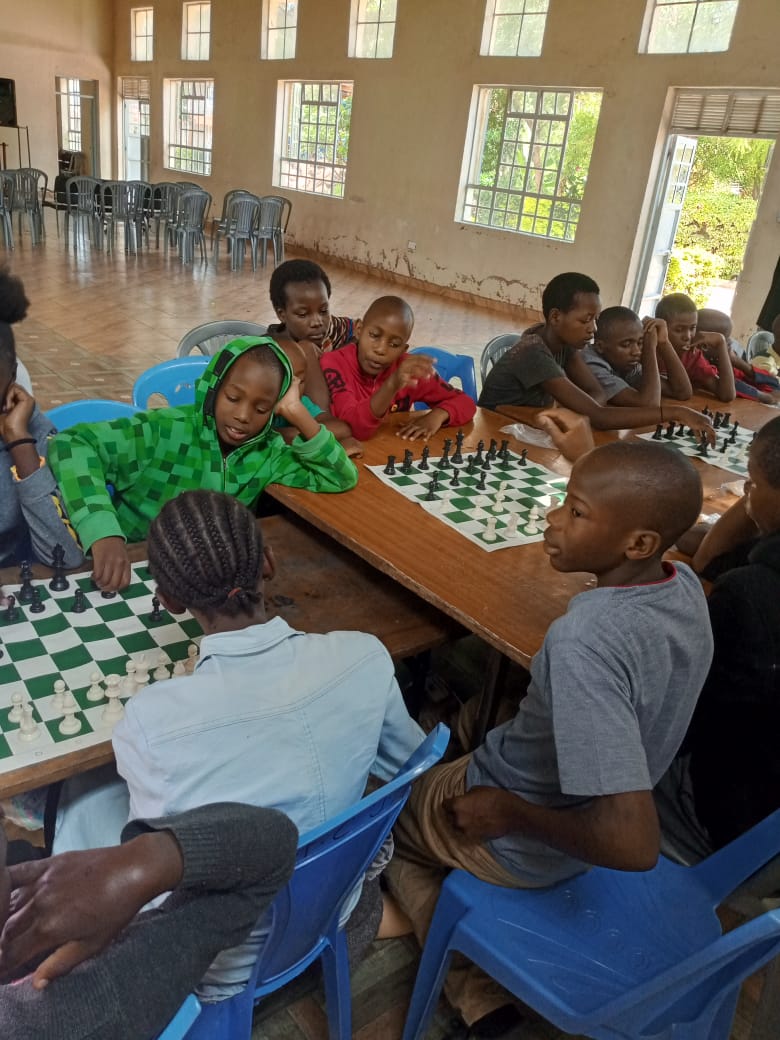 peter_lexus's tweet photo. We had a breathtaking Chess session at Happy life Children's home, Kenya. Since Chess is a game of outmaneuvering your opponent and anticipating their next move, it emulates how one must be aggressive and strategic in everything they do. https://t.co/ENA1WefQjS