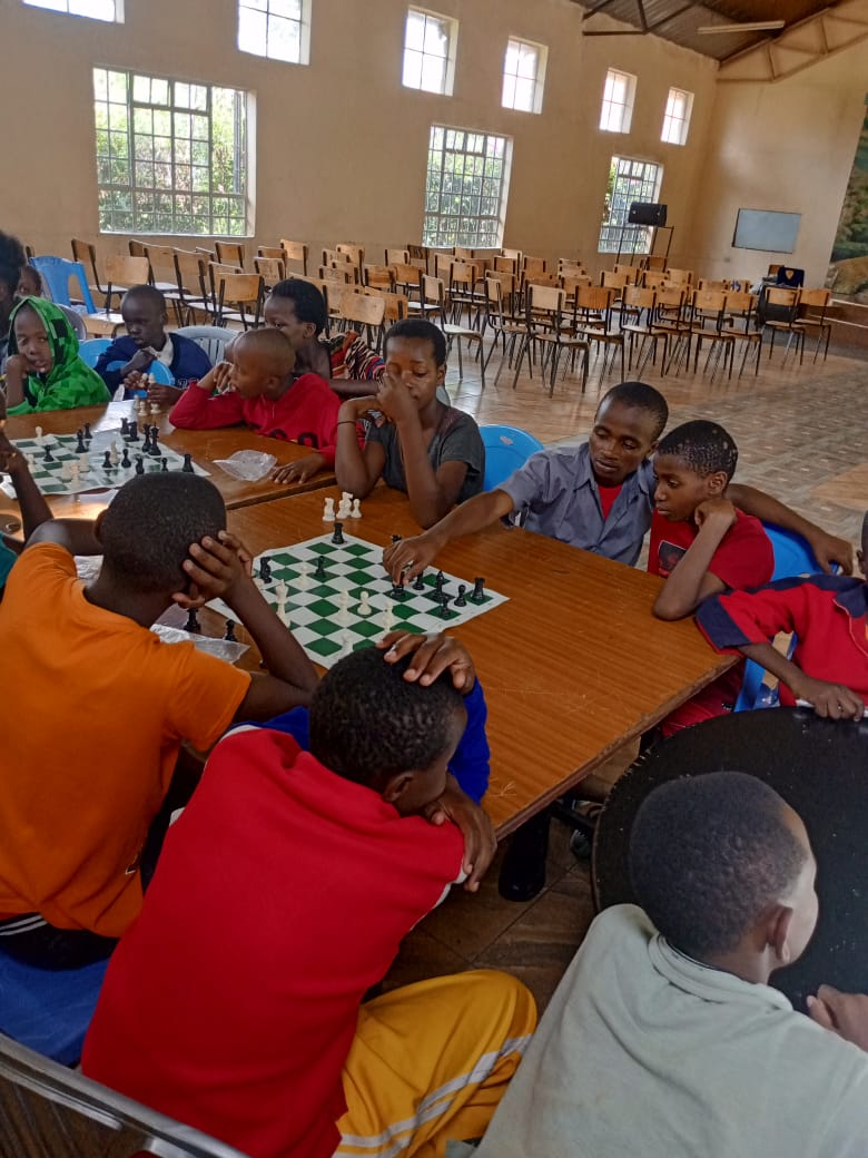 peter_lexus's tweet photo. We had a breathtaking Chess session at Happy life Children's home, Kenya. Since Chess is a game of outmaneuvering your opponent and anticipating their next move, it emulates how one must be aggressive and strategic in everything they do. https://t.co/ENA1WefQjS
