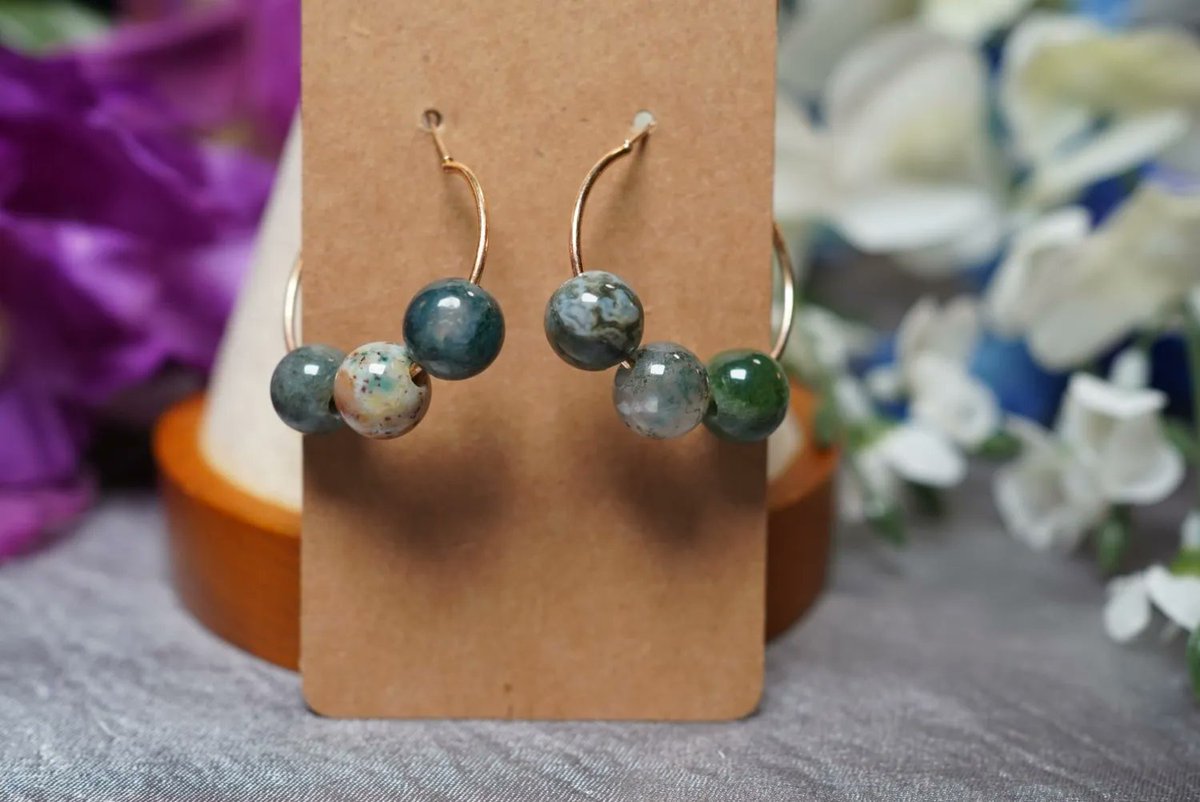 🌿💎🔮 Elevate your look and spirit with our moss agate earrings! Moss agate against your body is said to bring a sense of calm and balance, and help release old patterns and negative emotions buff.ly/43iWDsM  ✨ #mossagateearrings #calming #healingenergy 💚💫 #mossagate