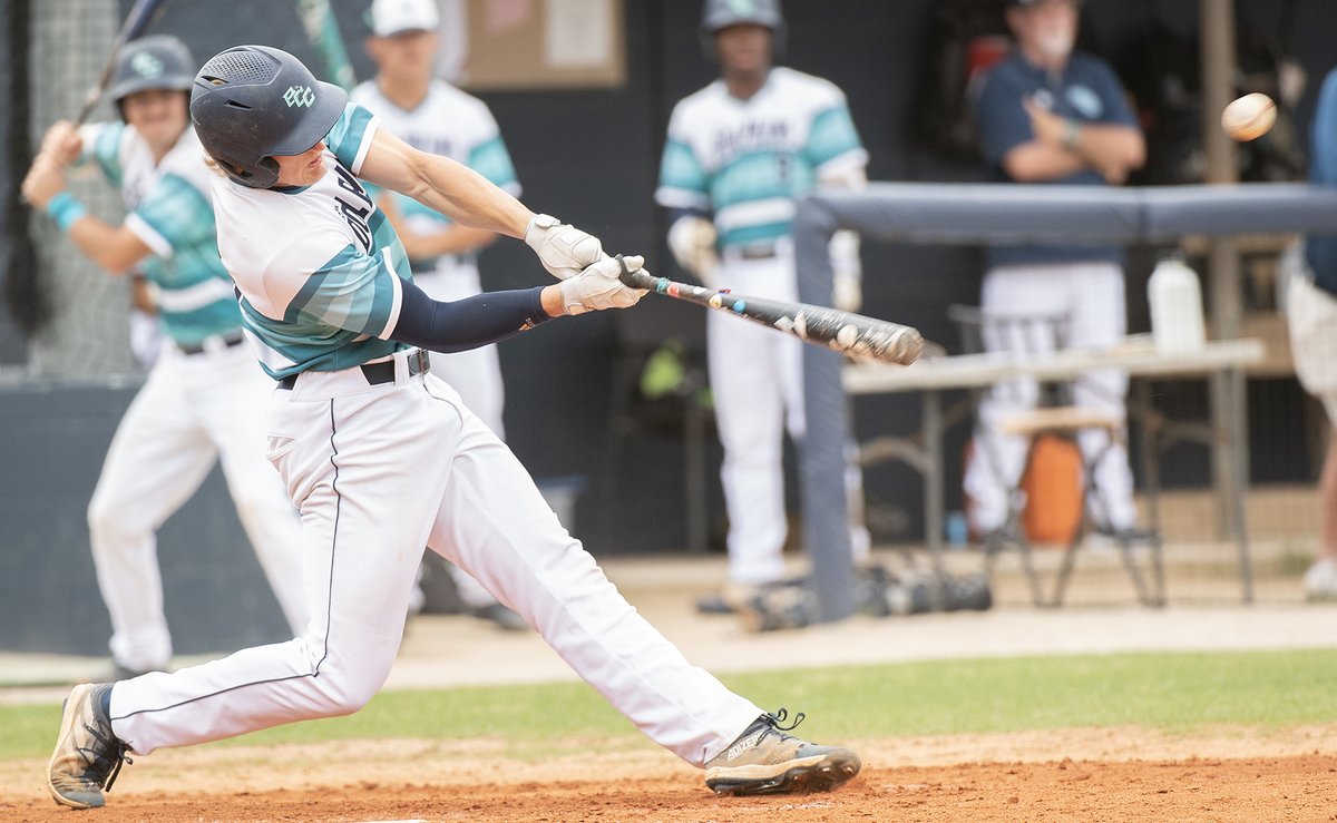 Roman Dilgard singles home a run in BCC’s game against Lenoir on Sunday. On Saturday he was was 2 for 3 with a walk, a double and two RBIs in the Dolphins’ 4-3 loss.