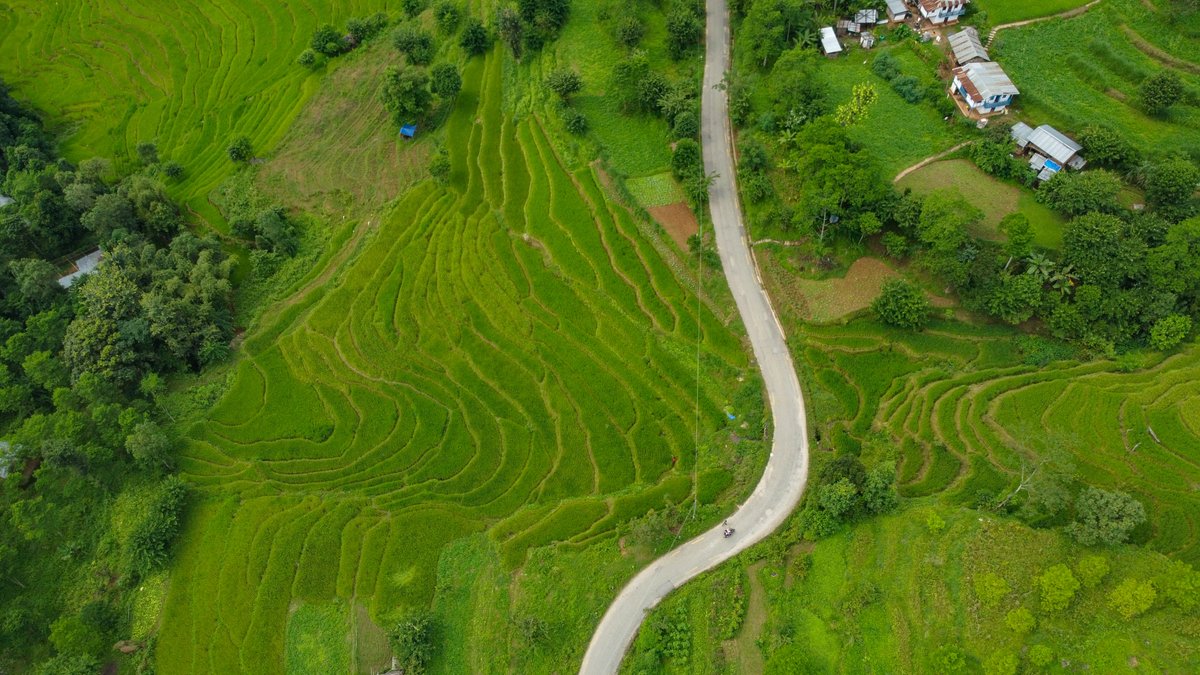 ADB_HQ's tweet photo. For a landlocked country like Nepal, road capacity is crucial for sustainable development. 

ADB helped the government upgrade 310 km of roads to connect communities to public services, farmers to markets, and children to school: https://t.co/uIXTcsAqTF https://t.co/fVOvM1TmdD