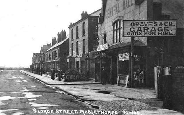 This photo is of George Street in #Mablethorpe. The buildings pictured haven't changed much - Graves Garage is now P&amp;Q DIY and the next building is the Montalt Arms, named for a local medieval baron.