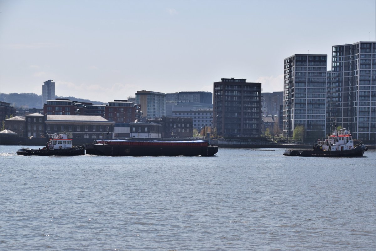AJBC_1's tweet photo. Moving #history!
Delivery to @CoryGroupUK of 1st of a batch of new refuse barges built @HarlandWolffplc Belfast site (1st vessels built there in > 20 years) - seen passing site of former H&W North Woolwich factory in #London.
#RiverThames #HARL #Cory #BoatBuilders
#dlr_blog https://t.co/4JL5TJH6oq