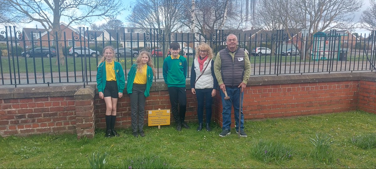 Members of Hawarden Dee Valley Rotary placed a plaque with children from Ewloe Green Primary School to mark the planting of crocus corms for World Polio Day.