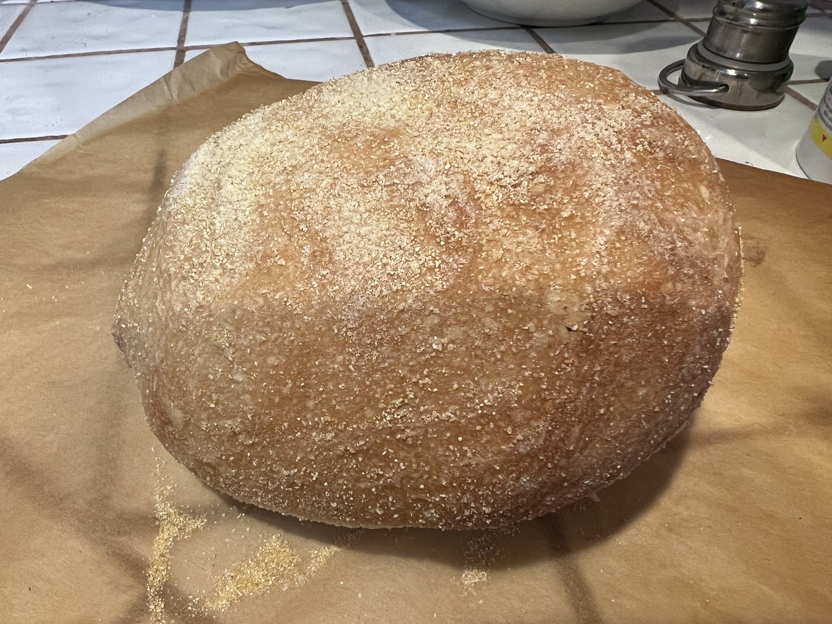 jumekubo's tweet image. My first attempt at making bread. Using Jeff Hertzberg and Zoë François, five minutes a day recipe. Forgot to cut the cross on top before placing in the oven. Still a bit doughy at the bottom of the loaf. Not bad tho. #breadmaking #notfiveminutes #funtolearn #lifelonglearning