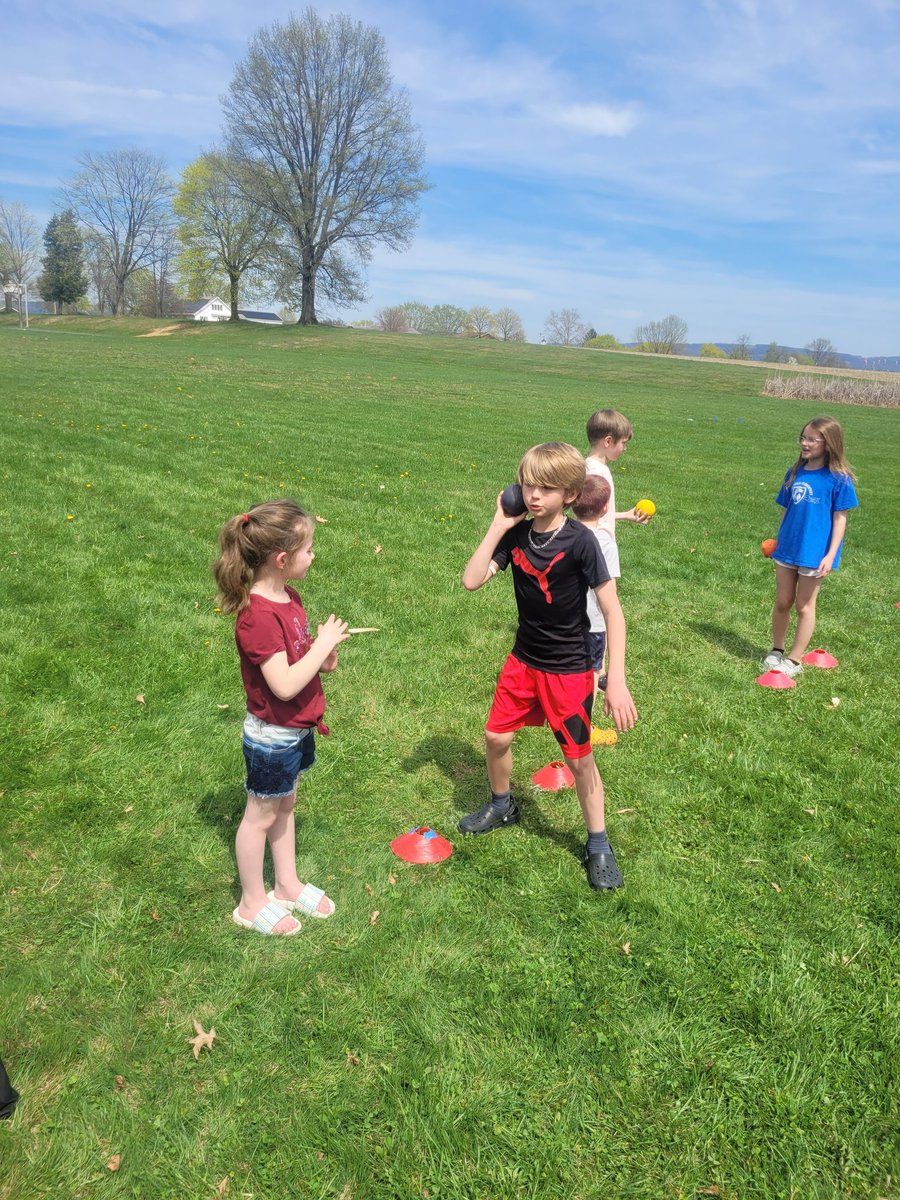 Third graders are helping Kindergarten students prep for Field Day!