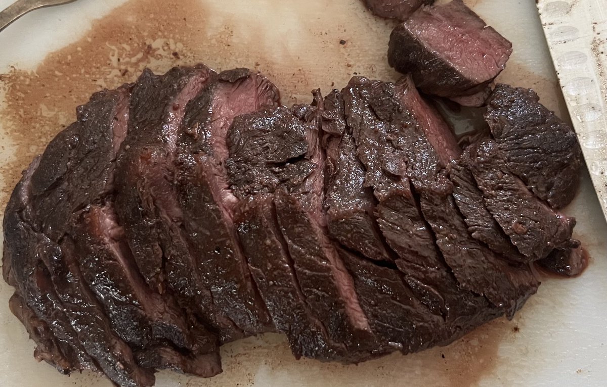 American bison hanger steak (diaphragmatic crura). Sous vide to 125F for 4 hrs. Salt, pepper, and seared in cast iron with 🧈. Rest. I made a chimichurri to go with it but the meat tasted so good on its own I barely used it. “Dad, can you get more bison?”. 😊