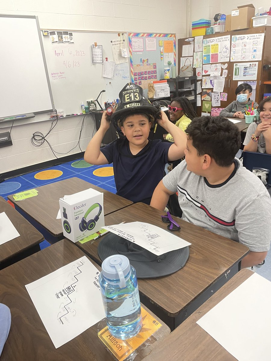 MrsFranklin18's tweet photo. Had a parent come in for Career Week this morning to teach us all about being a firefighter! 🧑‍🚒🚒 We even got to try on his hat! @rhandrewselem https://t.co/tqig5NsRu1