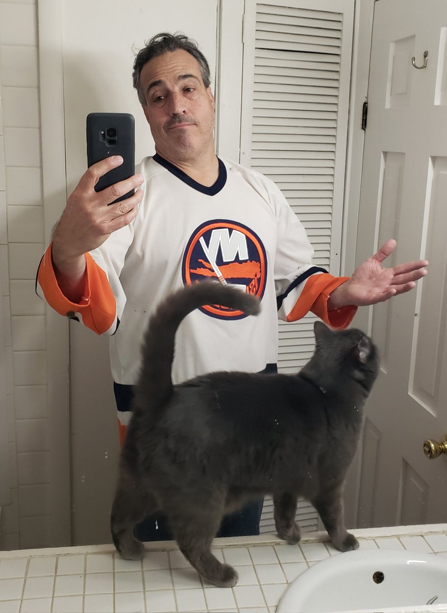 This is my, "I suppose we backed into the playoffs, so let's make the best of it."  look.
Meanwhile, my cat photo bombed me.
Pretty sure he's in the same boat, since he's backing the Panthers.