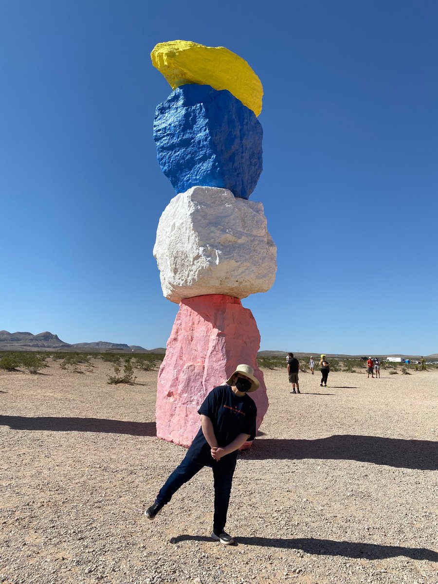 carrperez5's tweet photo. Re-enacting #RM ‘s pic at Seven Magic Mountains,LVegas on Apr 15,’23 @BTS_twt 
The bottom rock behind me was repainted pink instead of RM’s bright red orange due to vandalism of some people’s graffitis.  Now it’s baby pink. 
Some rocks were totally repainted. 
#BTS #RM #Namjoon https://t.co/mNwRll8HzR