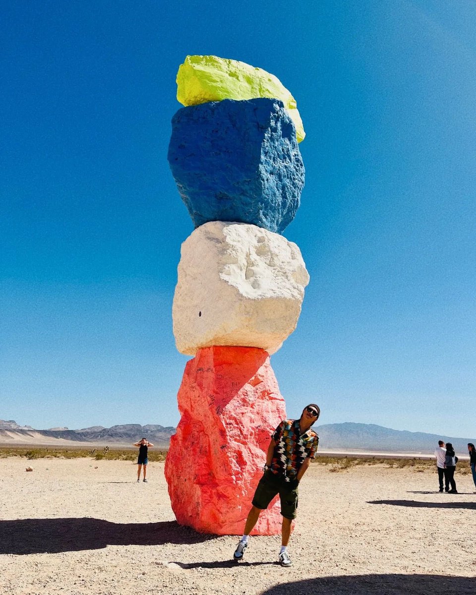 carrperez5's tweet photo. Re-enacting #RM ‘s pic at Seven Magic Mountains,LVegas on Apr 15,’23 @BTS_twt 
The bottom rock behind me was repainted pink instead of RM’s bright red orange due to vandalism of some people’s graffitis.  Now it’s baby pink. 
Some rocks were totally repainted. 
#BTS #RM #Namjoon https://t.co/mNwRll8HzR