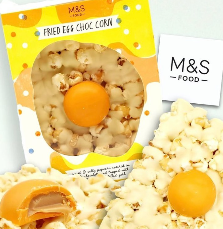 MEET the … FRIED EGG CHOC CORN! 🍿

Sweet &amp; Salted toffee POPCORN, COVERED in white chocolate, TOPPED with soft caramel filled yolk, that looks like a FRIED EGG! 🤩

EGGCELLENT Easter treat idea 😉

#mymarksfave
