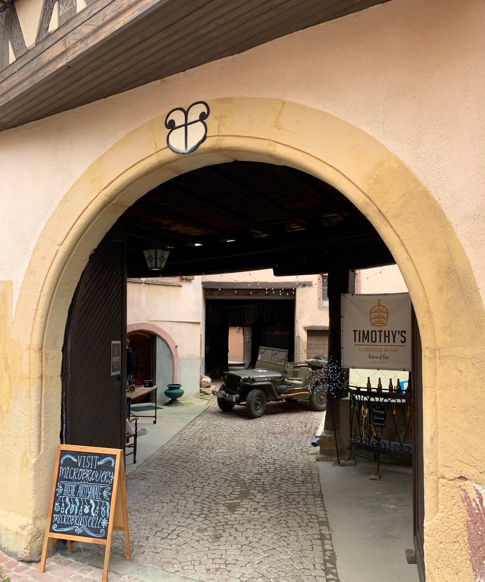 bartlebeer's tweet photo. Timothy’s Alsace-American microbrewery in touristy Eguisheim. Featuring the jeep his grandfather landed in Normandy with. No family time for tastings - will report from home how the APA/IPA/Triple/Stout/Blonde adapted to the 30 local vigneron... #Gallozythopia 🇫🇷🇺🇸 https://t.co/e0E6NXhRoa