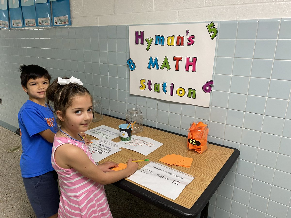 First graders love solving problems at the math station!