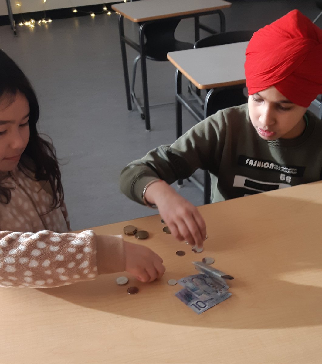 Ss got to apply their mathimatical understanding in a real-life situation... helping Mrs. Wilson count $ collected for Loonies for Literacy.  <a href="/HABschoolCBE/">HughABennettCBE</a>