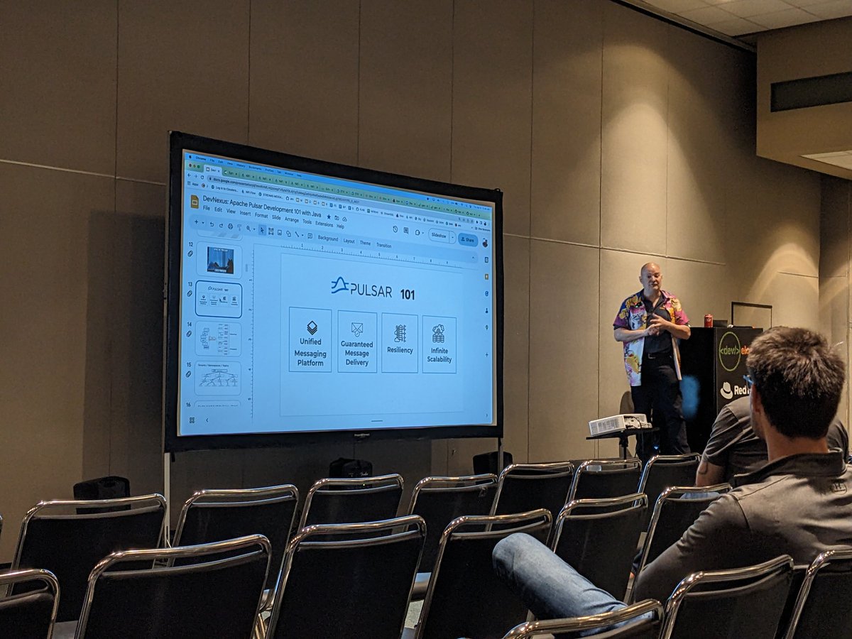 mgrygles's tweet photo. My "community colleague" Tim's rocking on stage with #apache_pulsar @devnexus !! https://t.co/pkPlqTqUms