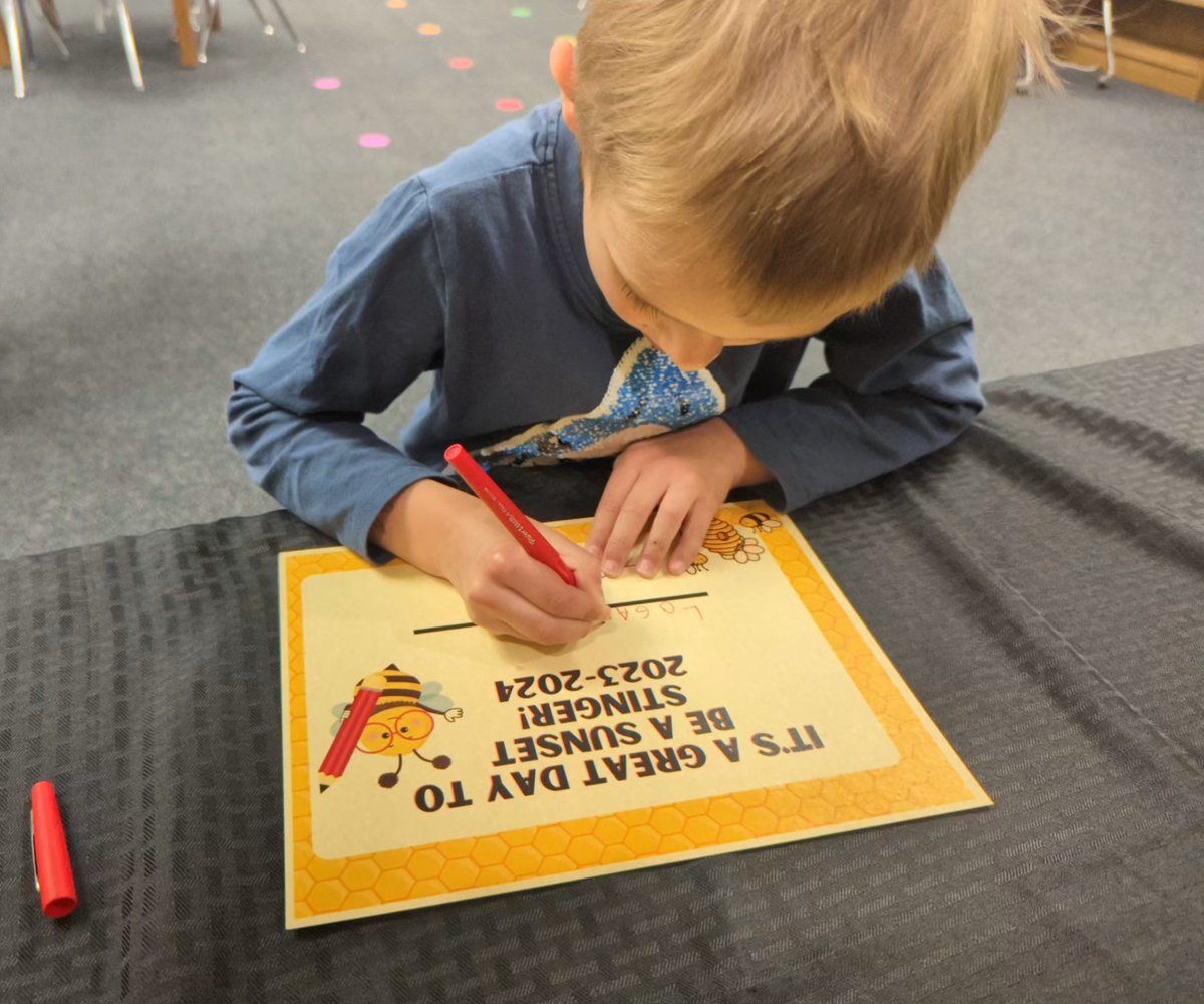 NewtonSchoolsKS's tweet photo. Today is a big day for our elementary schools: Kindergarten enrollment! 

At Sunset Elementary, future Stingers are "signing" with the school on a keepsake certificate with Kindergarten teachers Ronna Hammel and Addie Kauffman. 🐝 https://t.co/PaQI8PQprB