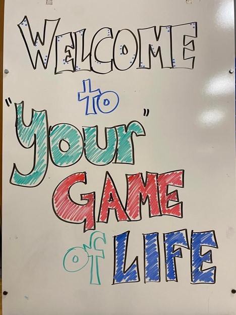 sddoe's tweet photo. Hanson School District turned SD Week of Work into their very own Game of Life. At each stop, presenters introduced themselves and their job, explained their duties and the service provided by their company, and connected students to careers and businesses. #SDWeekofWork https://t.co/5LM1orq7L2