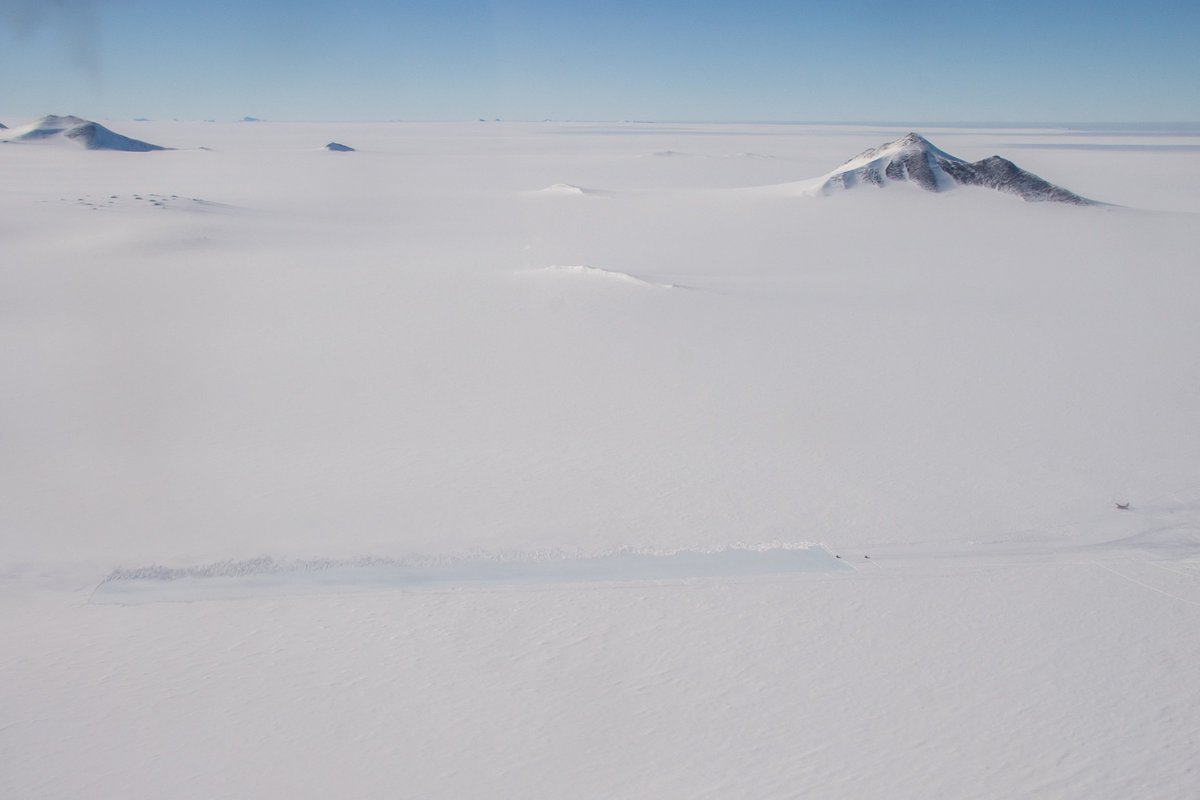 Hughes_Matt's tweet photo. It doesn't look like much but this is one of the most important places in Antarctica for us. 

This is Sky Blu, sitting down at the base of the peninsula, it's your last stop before going ‘deep field’. We've got fuel here, an ice runway, and supplies to keep you going for months. https://t.co/QTC4G6lbOI