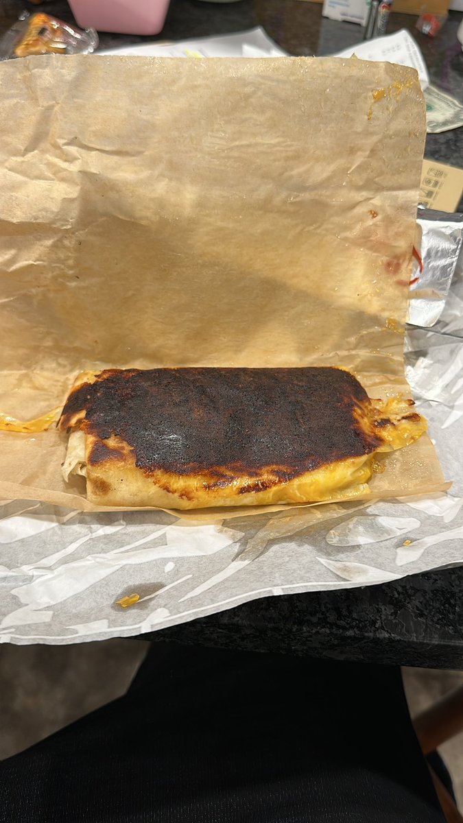 Thanks <a href="/tacobell/">Taco Bell</a> for the burnt Grilled Cheese Burrito after waiting ten mins in line!