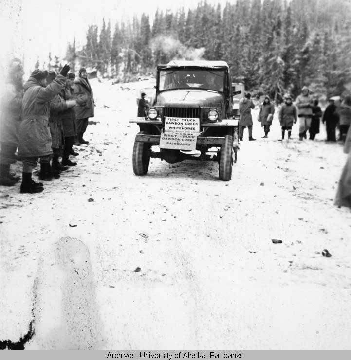 ANC_Historian's tweet photo. Sep 1942, the first truck to drive the entirety of the Alaska Highway (Alcan). It drove from Dawson Creek to Whitehorse. From there, it drove on to Fairbanks, at some point gaining the extra sign. #alaskahistory #alaskahistory #cdnhist #alcan https://t.co/qEgq55UwM7