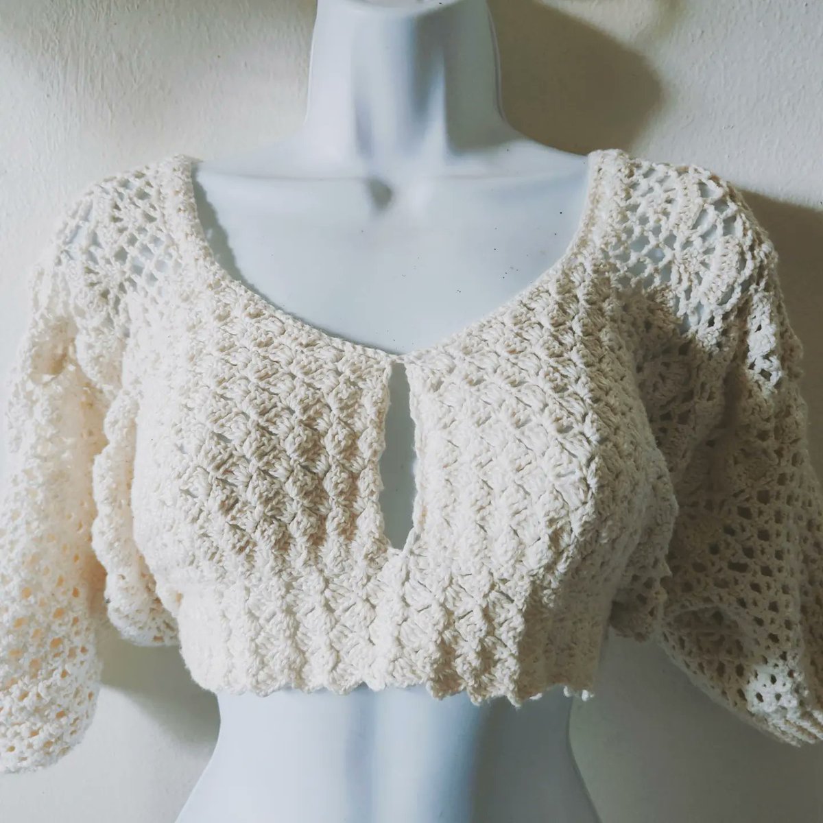 This crochet top is lovely! From the style and the soft color, I love everything about it! This beautiful handmade garment was made in 💯 cotton.  DM me for sizes and colors #crochet #crocheted #crochetfashion #handmadecrochet #crochetoutfit #top  #beigeaesthetic #versatile