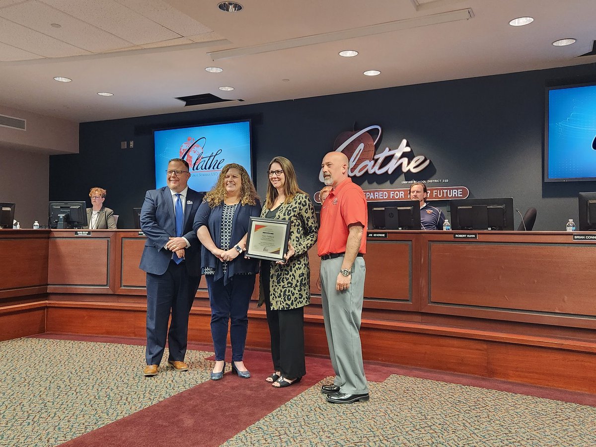 OlatheEastHawks's tweet photo. Congratulations to Stacy Goddard being recognized at tonight’s @olatheschools Board of Education meeting for the Kansas Debate Coach of the year.  @OEActivities https://t.co/1y9PYDdu01