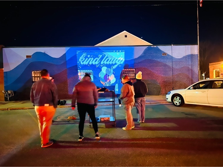 Hemlock High School Art Club works on the mural late tonight. Thank you Mrs. Woodcock and students for helping make our town huskietastic. #PULLTHESLED