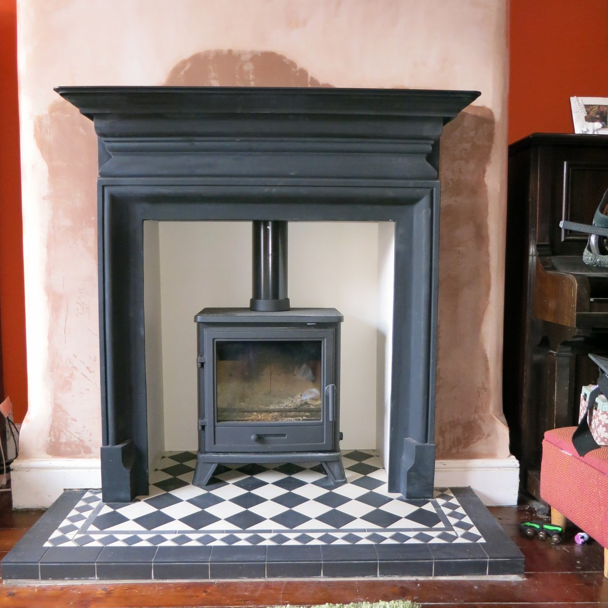 Another happy #sale client with the installation of their @percydoughty <a href="/rapidcarrot77/">Cece Mulroy</a>  Penman Bassington cast iron stove with a black and white tiled hearth, black Palmerston surround and an <a href="/FocusFireplaces/">Focus Fireplaces Manufacturing</a> beam. #theheatison