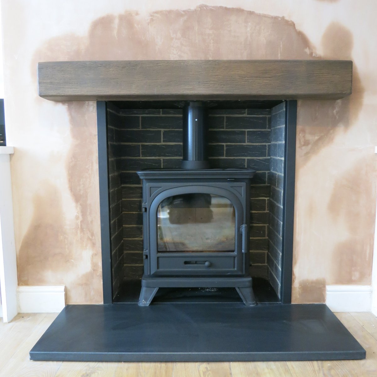 Another happy #didsbury client with the installation of their @percydoughty <a href="/rapidcarrot77/">Cece Mulroy</a> Penman Avebury cast iron stove, grey brick bond chamber with an <a href="/CheshireMarble/">Cheshire Marble</a> black granite <a href="/FocusFireplaces/">Focus Fireplaces Manufacturing</a> beam. #theheatison