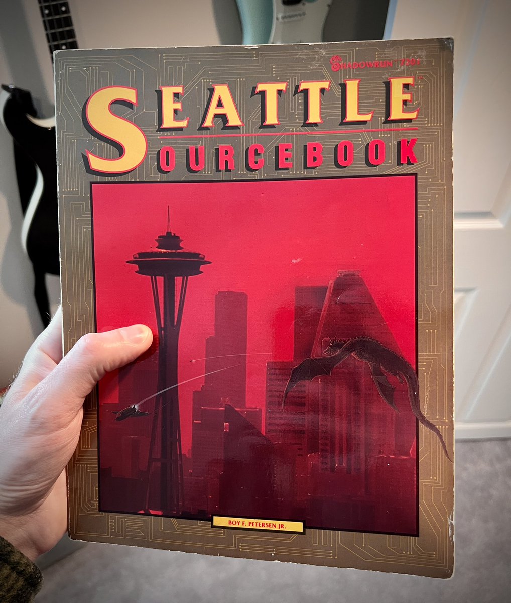 PinkFohawk's tweet photo. I don’t care what edition of #Shadowrun you play, you need to own this book. It’s the most unique take on world-building I’ve seen in a sourcebook, and most of the info is still valid in later editions. Use it as an in-world coffee table book on 2050s Seattle, just use it! https://t.co/IE7ScXyhjU