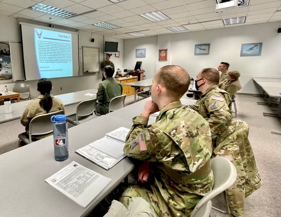 Capt Frye and MSgt Miller visited the University of Alaska Anchorage's AFROTC detachment where they taught a lesson on military justice and spoke with cadets about the JAG Corps. Capt Frye commissioned in 2022 and is the Chief of Admin Law at Joint Base Elmendorf-Richardson.