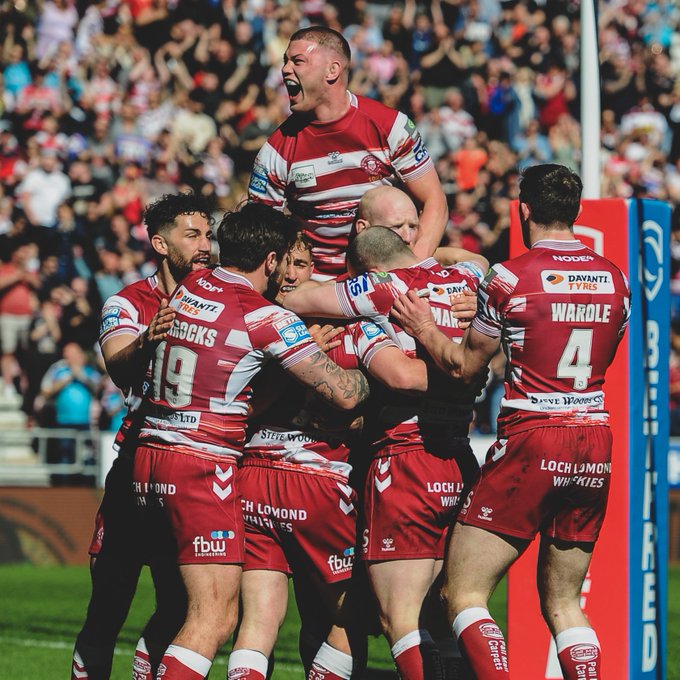 Wigan Warriors celebrate a try. 
