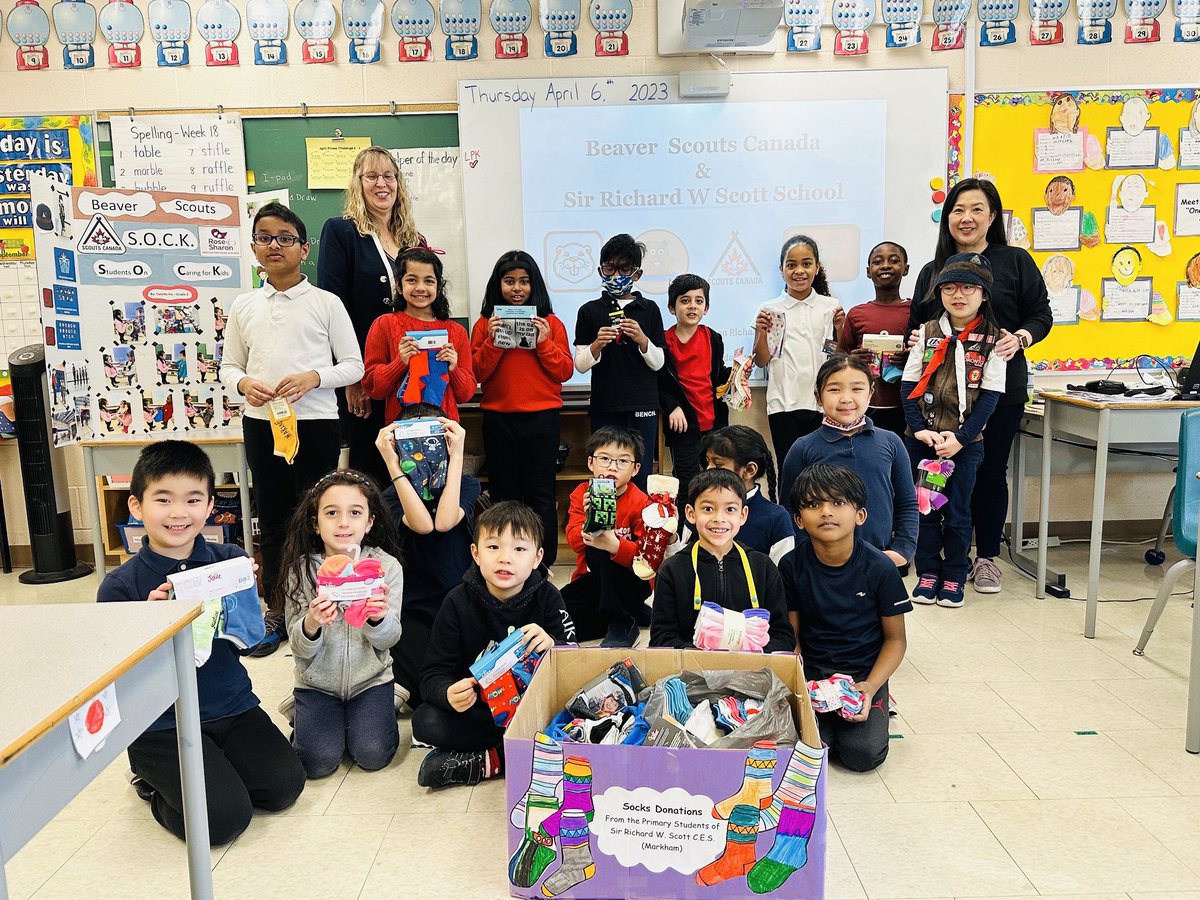 Ms_B_Kung's tweet photo. Primary students participated in almsgiving by donating socks to the Catholic charitable organization, Rose of Sharon. The initiative was lead by our Grade 2 student, Colette H., as part of her Beaver Scout community outreach program. ⁦@SRWS_YCDSB⁩, ⁦⁦@YCDSB⁩ https://t.co/C4FiqapY1X