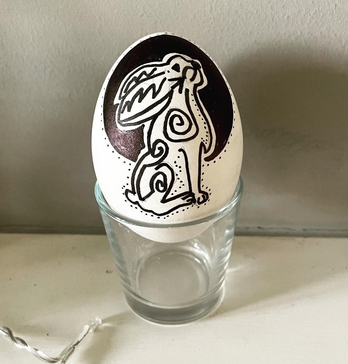 I blew two goose eggs and dyed one, then decorated the white one - one side with a Celtic dragon, the other with a pagan hare gazing at the moon (both inspired by designs on Pinterest) #easter #eastereggs #eggs #gooseegg #easterdecorating #easterdecor #celtic #dragon #hare