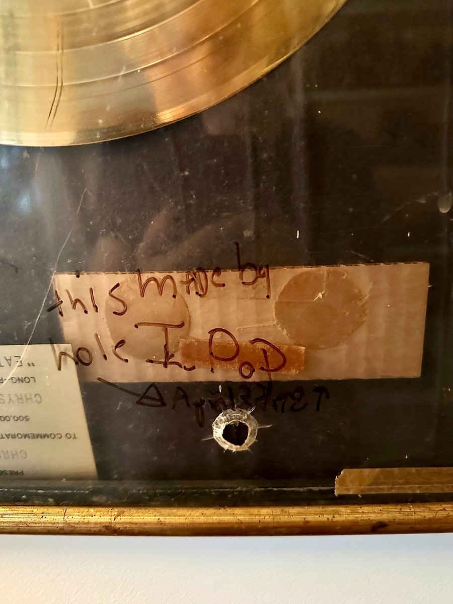 Request for more ephemera. A favorite. Was shooting an old Luger with Iggy in my basement and he shot a hole in an Eat To The Beat gold record. I got him to sign it: "This hole made by I Pop April 28 1989"