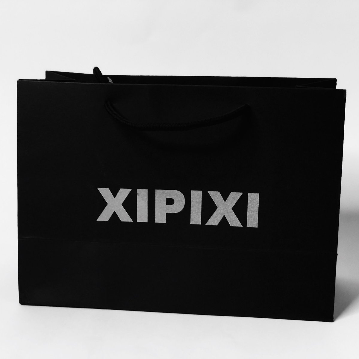 XipixiOfficial's tweet photo. #Xipixi proudly unveils its new logo signaling a new corporate identity. The new logo boasts a minimal, functional, sleek and modern sans-serif typeface adaptable to formal and informal clothes and accessories.The new logo can be seen in the new baseball caps and shopping bags. https://t.co/s8B0EbqBo1