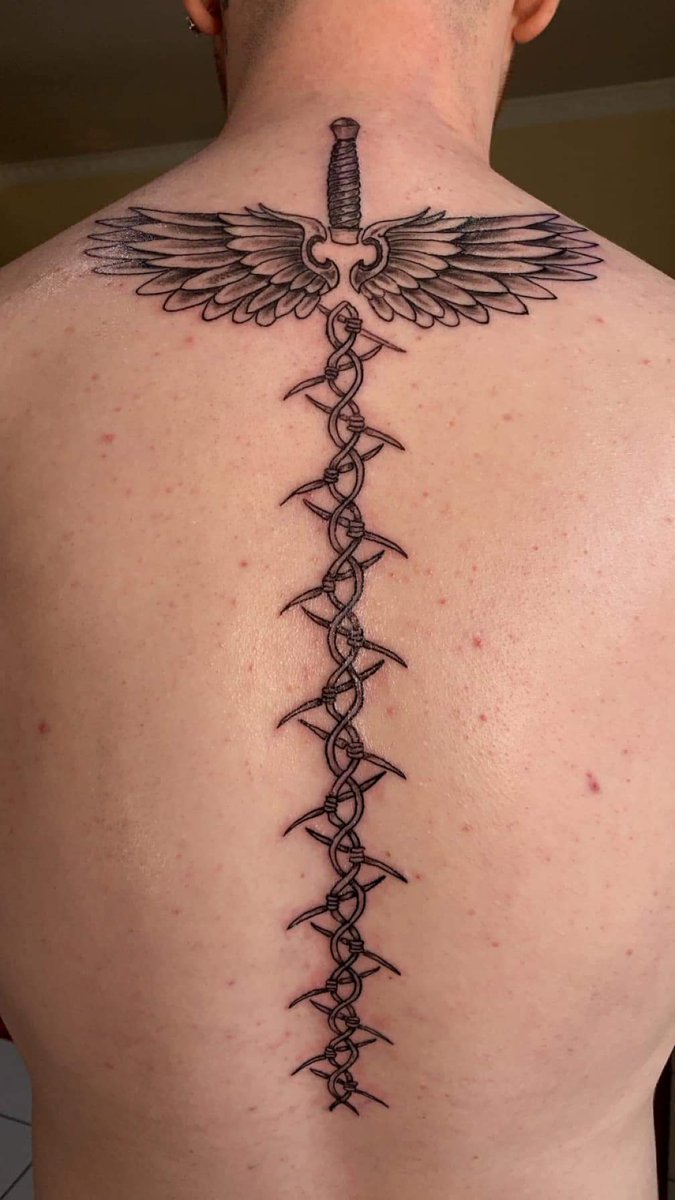 TwistedReaper22's tweet photo. Few more recent tattoos I've had the pleasure of doing 😊 #tattoos #tattoo #maryport #barbedwiresword #sword #barbedwiretattoo #mentalhealthribbon #memorial #memorialfeatherandrose #feather #rose #mandala #thightattoo #behindeartattoo #armtattoo #spinetattoo https://t.co/4JX9jnRylg