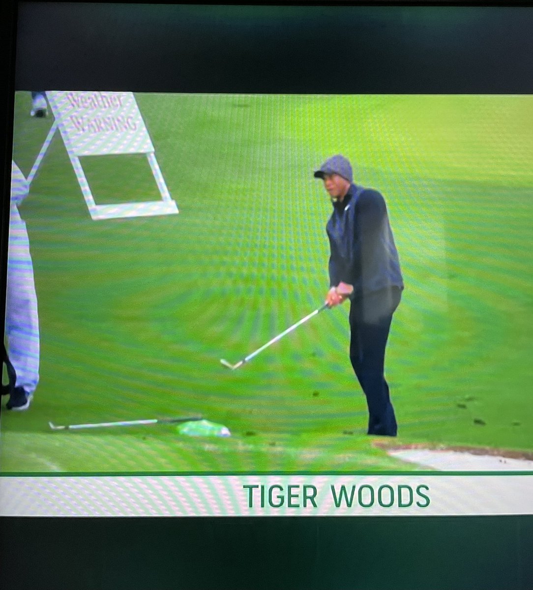 beanie over the hat Tiger 

once again proving that only he is capable of making this look cool