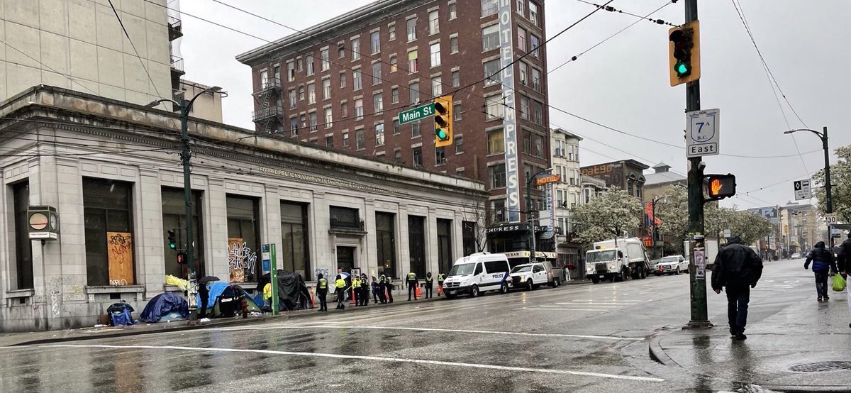 defund604's tweet photo. Saturday April 8 9:30 AM. Street sweeps and mass displacement continue in the #DTES this morning. There continues to be a large police presence, backing @cupe1004 workers as they force-evict people from public space. https://t.co/hy4fAq5MPV