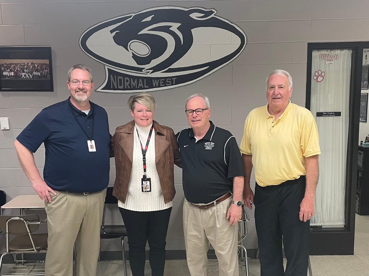 So much history in one room! 
Normal West had two distinguished visitors this week.  Former West Principals Jerry Crabtree (far right) and Tom Eder (second from right) joined Dave Johnson in welcoming Angie Codron as the next principal of Normal West High School. #unit5pride